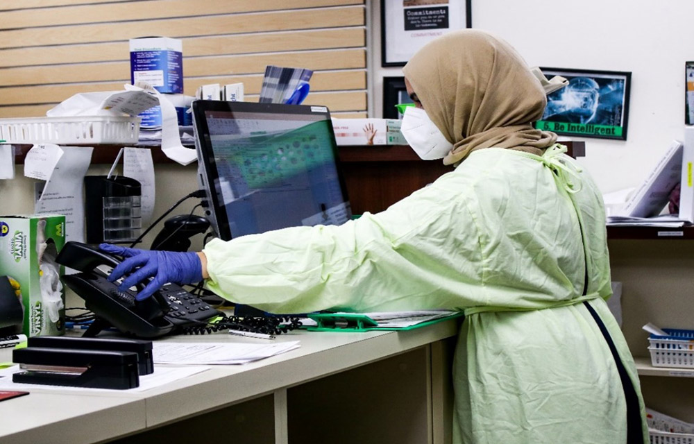 Pharmacovigilance team monitoring adverse events